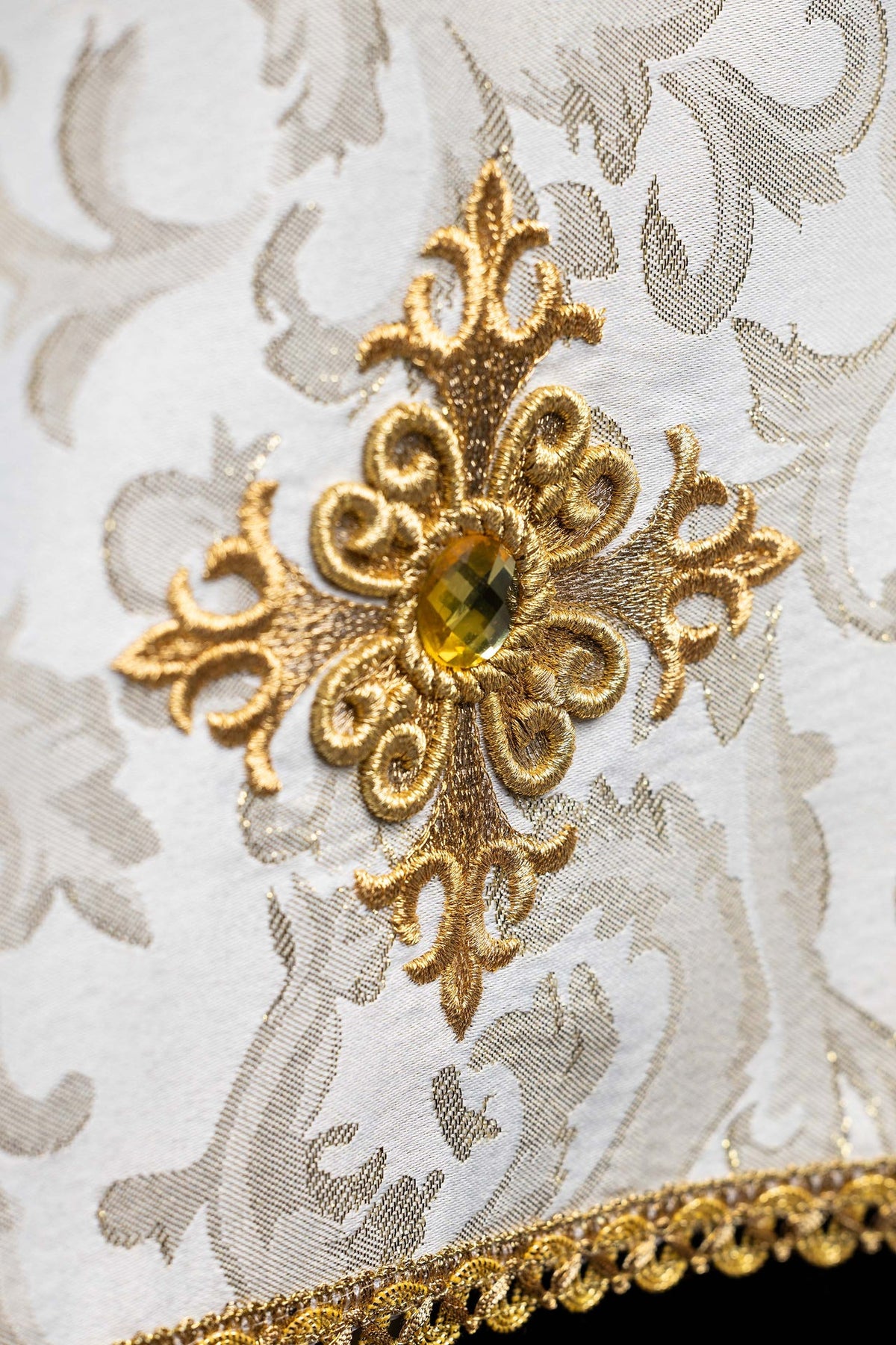 Ecru chalice veil with embroidered cross and ecru stone, close-up view
