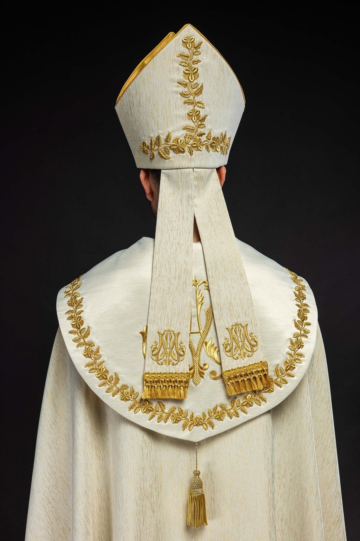 Ecru Marian mitre with rich gold embroidery and floral patterns