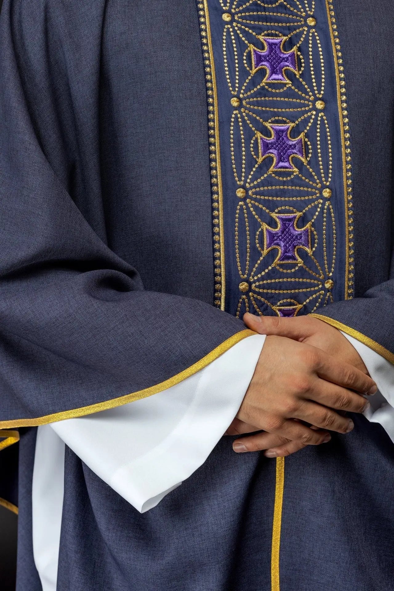 Liturgical chasuble with richly decorated belt with crosses in purple color