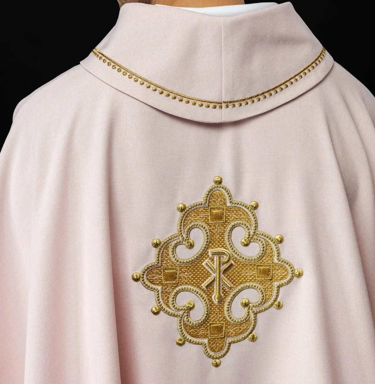 Chasuble with embroidered cross and gold trim on collar in rose color