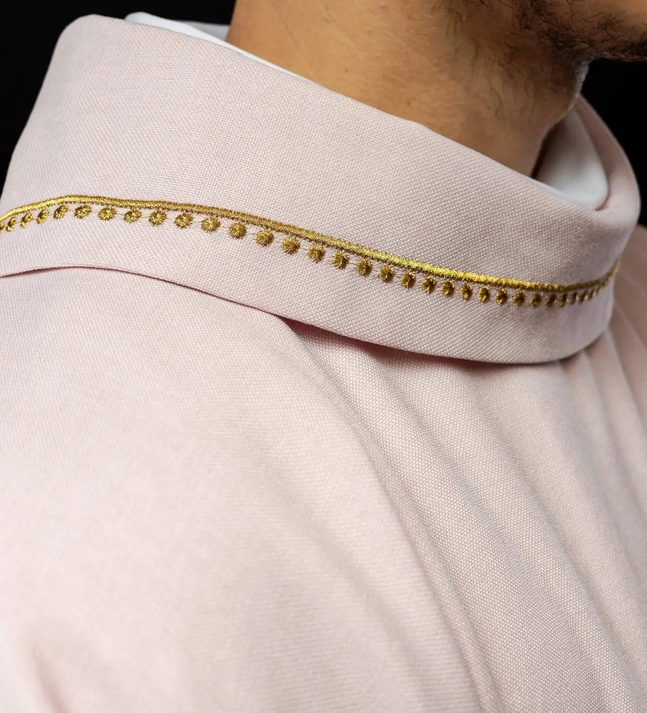 Chasuble with embroidered cross and gold trim on collar in rose color
