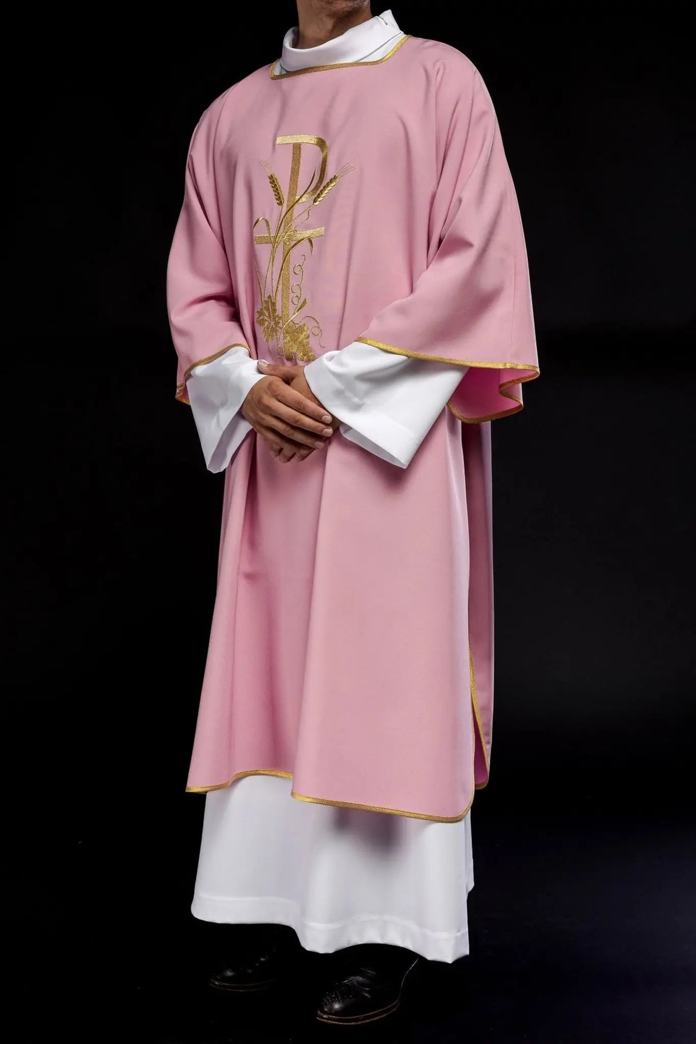 Pink dalmatica with gold Pax cross embroidery